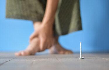 Concept of nail penetrating injury and tetanus.