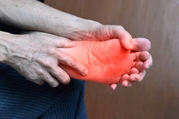Tingling and burning sensation in foot of Asian man. Foot pain. Sensory neuropathy problems. Foot...