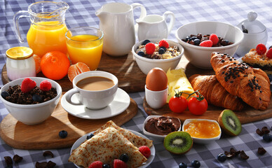 Breakfast served with coffee, juice, croissants and fruits