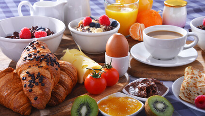 Breakfast served with coffee, juice, croissants and fruits