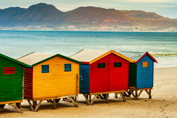 Naklejka premium Picturesque bathing huts in Muizenberg beach, Cape Town, South Africa 