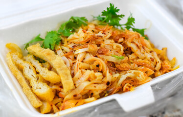 Myanmar traditional or classic white flat noodle salad called Khauk Swe Thoke
