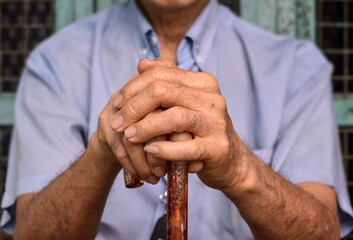 Hand of Asian elder man. Concept of rheumatoid arthritis, osteoarthritis, or joint pain