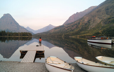 Photographer waiting for sunrise, Two Medicine Lake Glacier National Park, Montana USA
