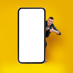 Happy Man Posing With Big Cellphone Gesturing Like, Yellow Background