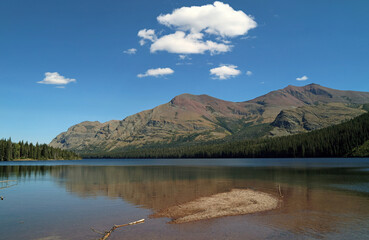 Two Medicine Lake with blue sky and white cloud, Glacier National Park, Montana USA

