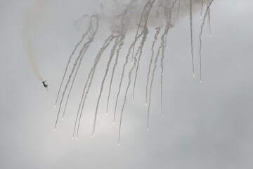 The SU-35S multifunctional fighter from the Russian Knights aerobatics group conducts shooting of false thermal targets