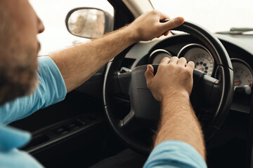 Cropped Shot Of Man Honking Driving Sitting In Car