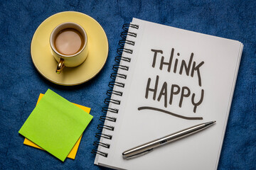 think happy inspirational handwriting in a sketchbook with a cup of coffee,  personal development, mindset, happiness and positivity concept