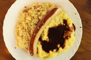mashed potatoes with sausage and pickled cabbage