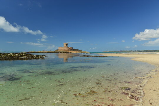 St Ouen’s Bay, Jersey, U.K. Beautiful natural beach in the Summer with Rocco tower.