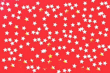 Obraz na płótnie Canvas Red background with glitter stars. Festive packaging design. 