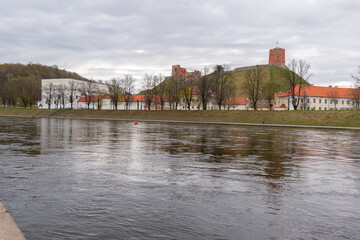 Obraz premium Gediminas tower and the old arsenal view accros the river Neris, Vilnius, Lithuania.