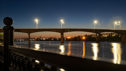 Fototapeta na wymiar bridge over the river at evening