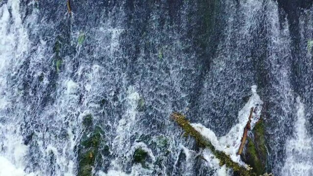 waterfall with a fallen trunk in Ega river. Drone view. 4K. Iguzquiza, Navarre, Spain, Europe.