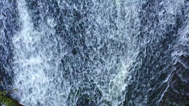 waterfall with a fallen trunk in Ega river. Drone view. 4K. Iguzquiza, Navarre, Spain, Europe.