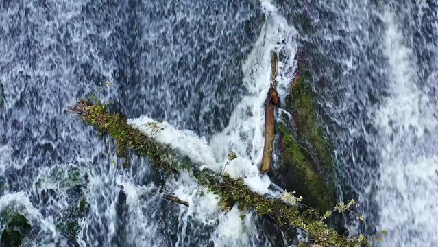 waterfall with a fallen trunk in Ega river. Drone view. 4K. Iguzquiza, Navarre, Spain, Europe.