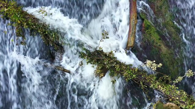 waterfall with a fallen trunk in Ega river. Drone view. 4K. Iguzquiza, Navarre, Spain, Europe.