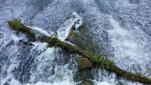 waterfall with a fallen trunk in Ega river. Drone view. 4K. Iguzquiza, Navarre, Spain, Europe.