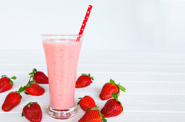 Strawberry yogurt fruit juice smoothie pink colorful fruit juice milkshake blend beverage healthy high protein the taste yummy In glass drink episode morning on white wood background.