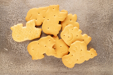 Several homemade zoological cookies on a metal tray, close-up, top view.