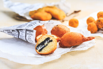 Finger food and street food - fried curd balls filled with Oreo cookies