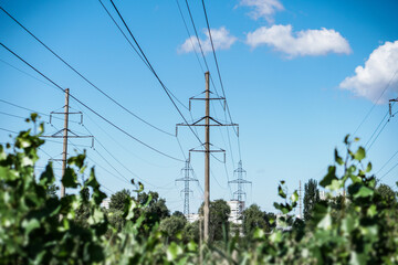 Obraz premium High-voltage power line against the background of the sky and nature. Green energy with renewable resources.