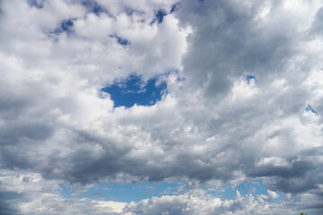 Obraz premium Clouds on the blue sky in sunlight. Great view from the plane.