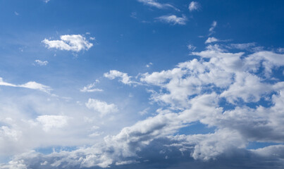 Obraz premium white fluffy clouds on blue sky in summer.