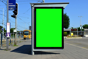 bus shelter at a bus stop. composite image of glass lightbox side ad panel and blank green place...