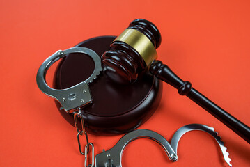 judge gavel with handcuffs