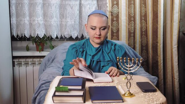 A Kippah-wearing Female Rabbi In A Progressive Congregation Prepares To Work With Parishioners. Medium Plan