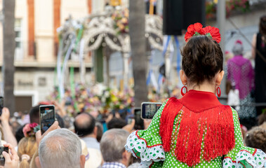 A rociera girl at the time of the presentation of the brotherhood of Rocío de Huelva in the city hall, on the day of her departure