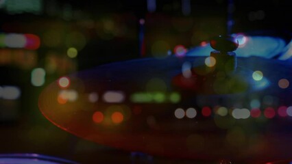 Animation of blurred night road traffic over percussion on concert - Powered by Adobe