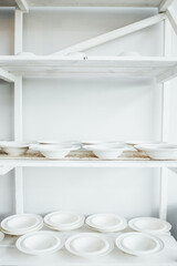 White plates on the shelving