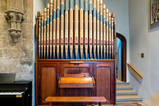 The stool, console and pipes of a small 5-stop pipe rack organ in Launde Abbey Chapel Church