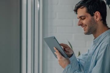 freelance man at home or office with digital tablet