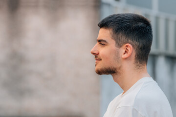 young man looking in profile with copy-space