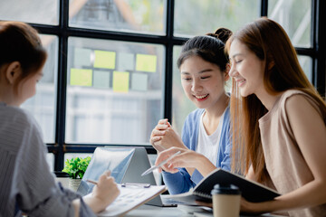 Groups of people gathered in the conference room, they were having a brainstorming meeting and planning meetings to manage the company's growth and profit. Management concept from the new generation.