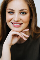 Fototapeta premium Portrait of beautiful young woman looking at camera