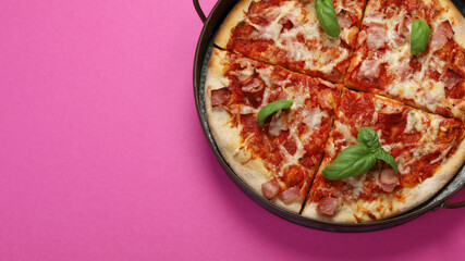 Pizza on pink background.