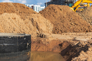 Concrete well sewerage, emergency well repair, septic tank for dirty water, installation of concrete rings. Sewer well in the water.