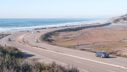 Pacific coast highway, Torrey Pines state beach, cars driving on road 1, freeway 101 from San Diego to Del Mar. Ocean sea waves, coastal roadtrip aesthetic, traveling during vacations. California USA.
