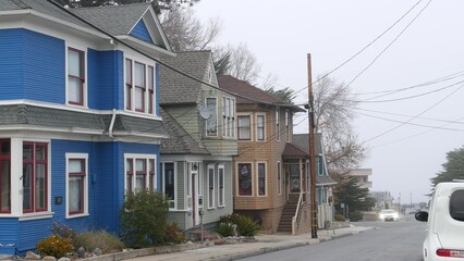 Row of old victorian style houses, historic residential district, Monterey, California USA. Colonial architecture, retro vintage suburban wooden classical cottages. Real estate property, city street.