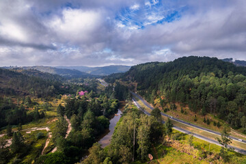 Obraz premium Aerial view of the Dom Pedro Highway in the city of Campinas. Road with lots of vegetation, trees and nature.