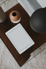 Flatlay of blank clipping path screen tablet pad. Elegant decorated coffee table. Lady, girl boss business, work, blog template with mockup space. Flat lay, top view