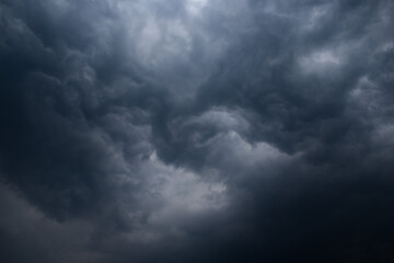 Dark rainy twisted thunderstorm clouds grey color horizontal image
