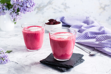 Delicious beetroot latte in glasses on the table. Healthy homemade vitamin drinks