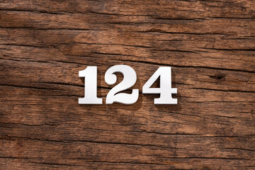 Number 124 - piece on rustic wood background
