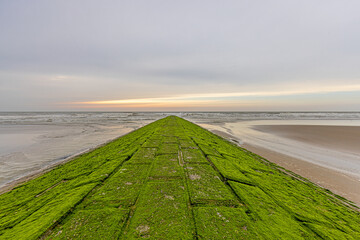 Panoramic image along a breakwater on the North Sea beach of the Belgian town of Middlekerke